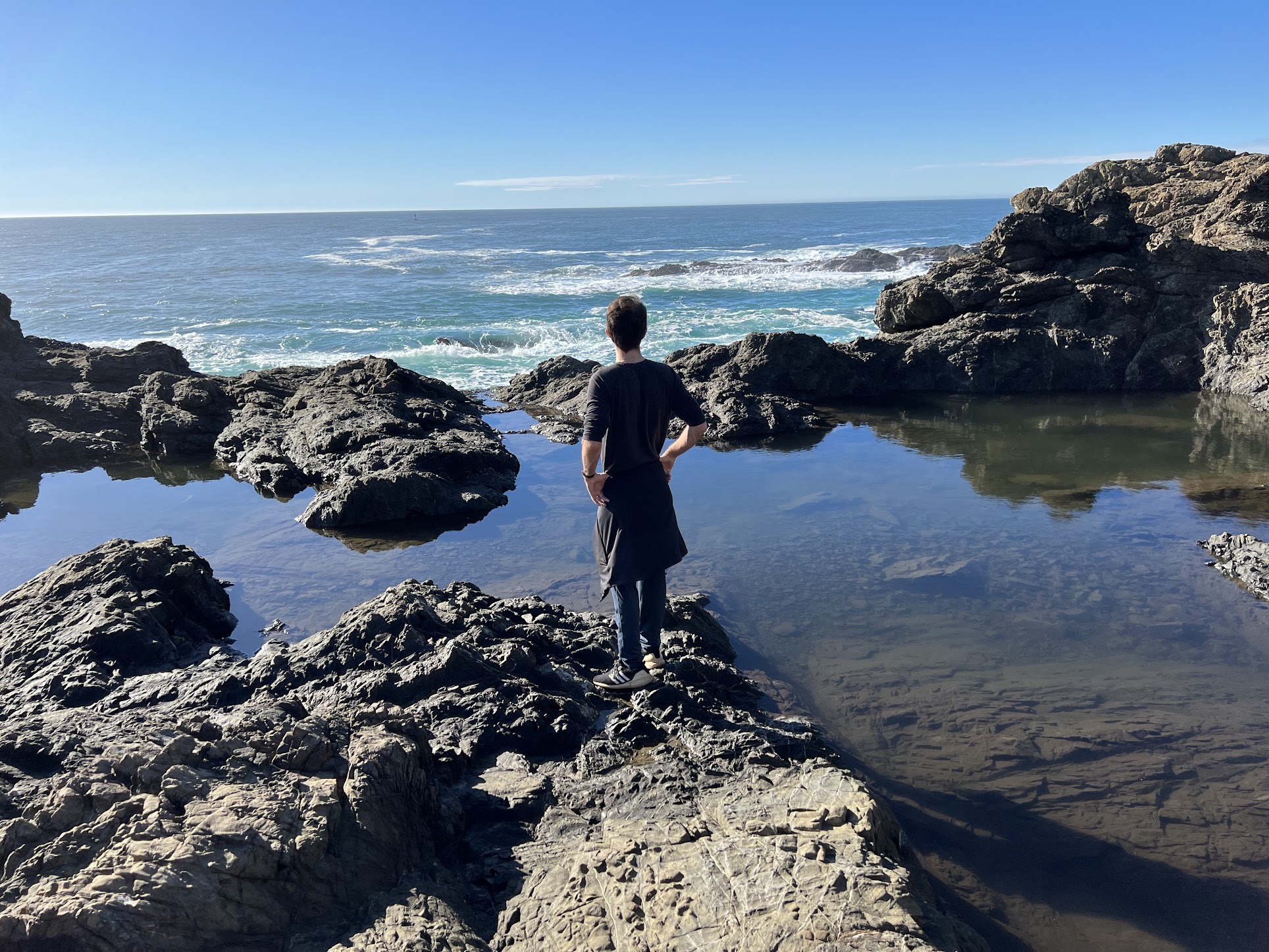 Sheltered cove at dusk with rising moon